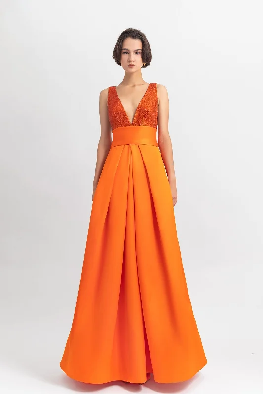 Deep V-neckline satin long dress with draping details a midriff waist and an open back.