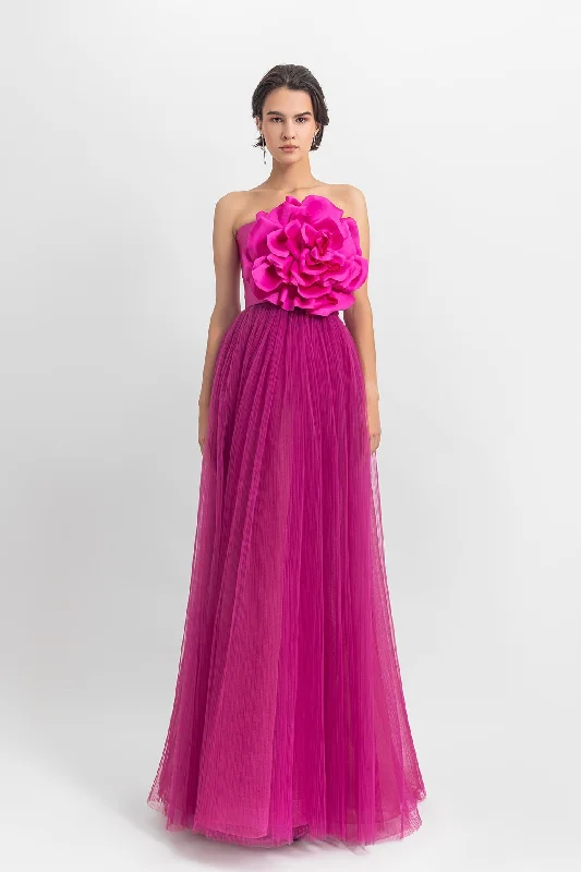 Strapless long dress with satin flower design on the top; fully-pleated from the bottom.